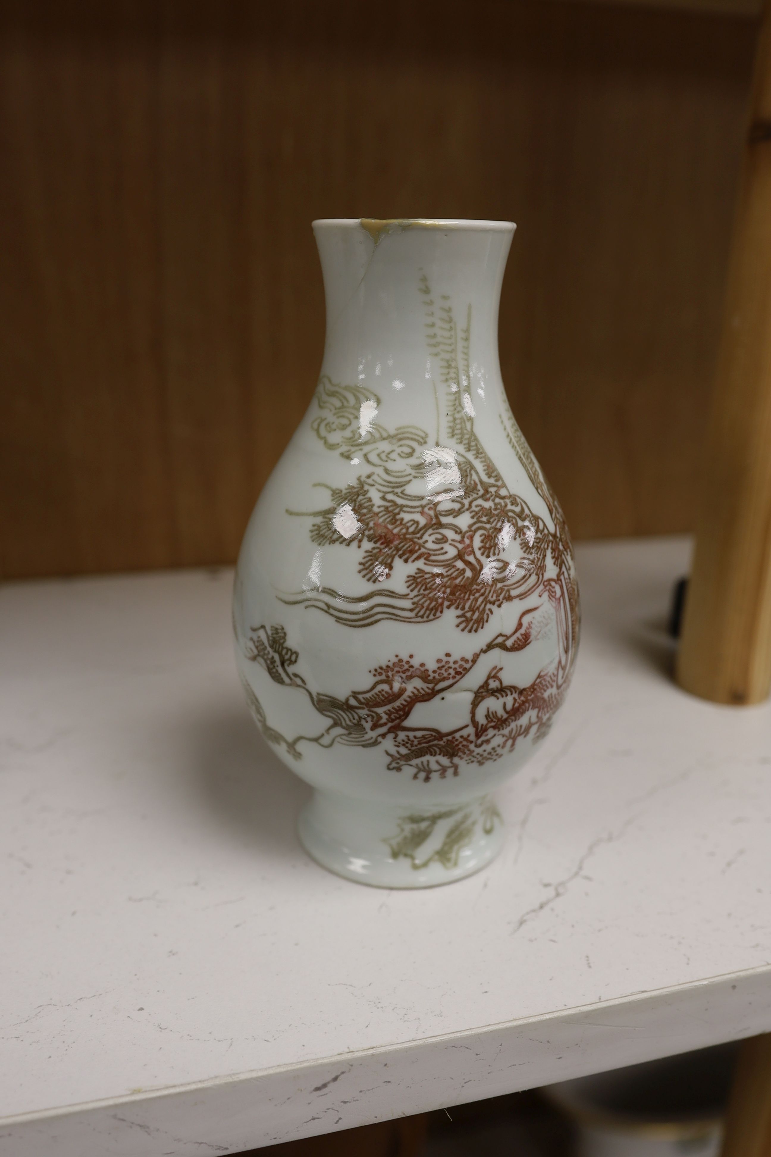 A Chinese underglaze copper red ‘herder and goats’ vase, Kangxi six character mark but Republic period and a Chinese blue and white lotus stem dish, six character Guangxu mark and period, both damaged